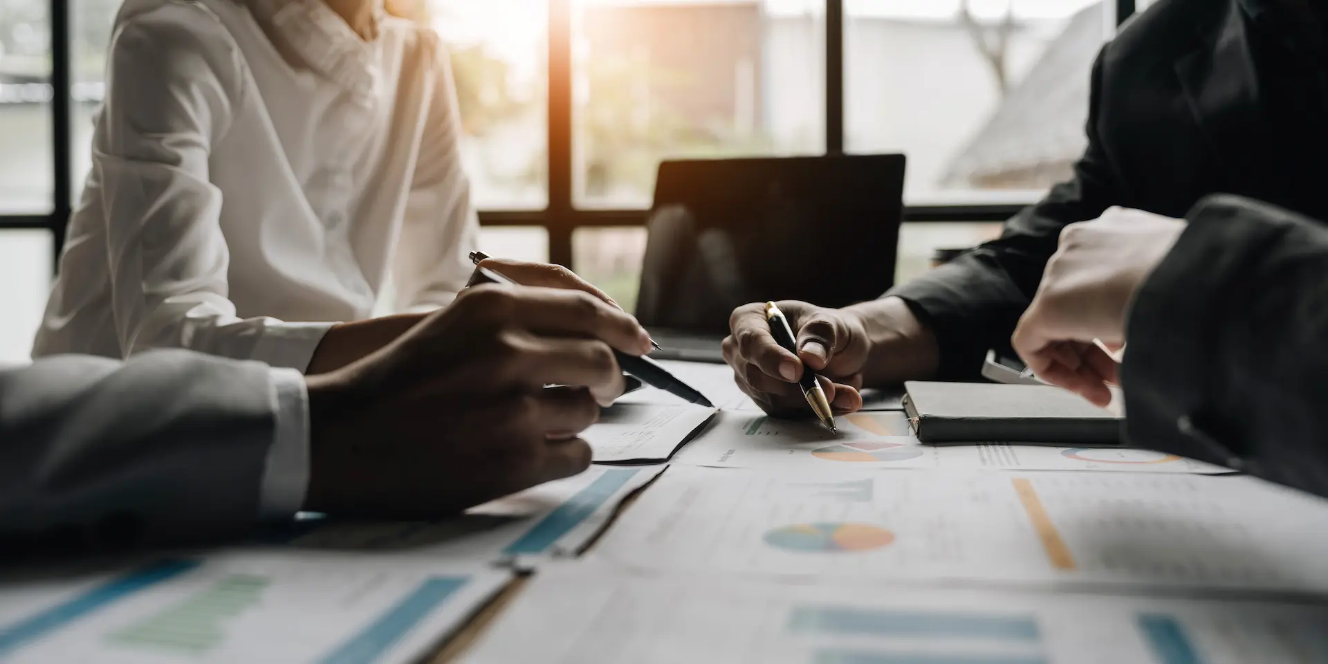 North Carolina business owners signing a tailored commercial insurance policy